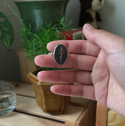 Fossil Leaf Ring held in hand