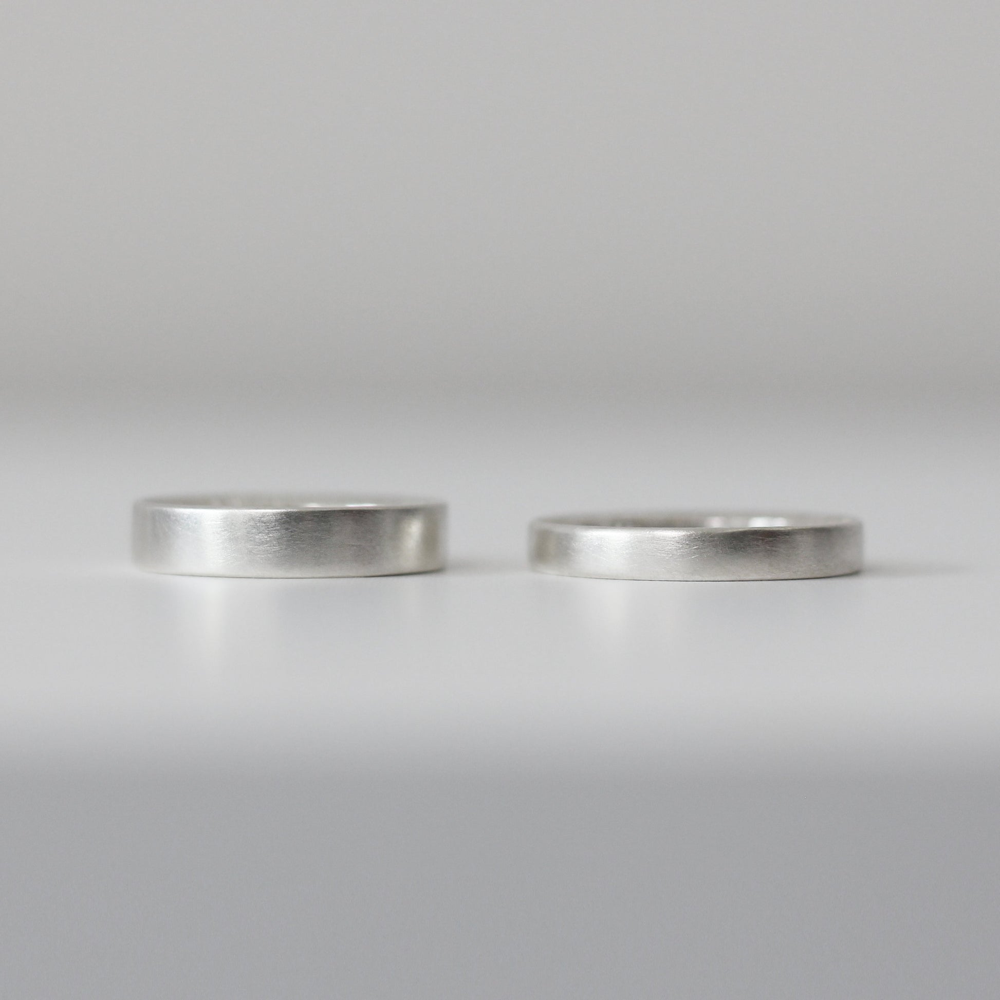 Sunshine Hammered Texture Band - Silver Hammered, 5mm and 4mm wide, alternative angle - Aisling Chou Studio